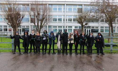 Students Holding Gardening Equipment donated from the Basildon Round Tavble